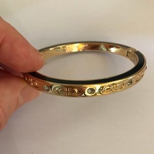 Gold kissing coach bangle